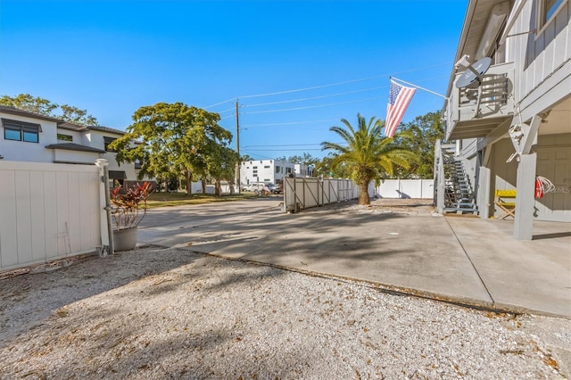 3511 Camino Real, Sarasota, FL 34239 - view of concrete driveway featuring stairs