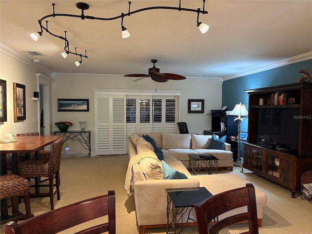 living room featuring light colored carpet, ceiling fan, and ornamental molding