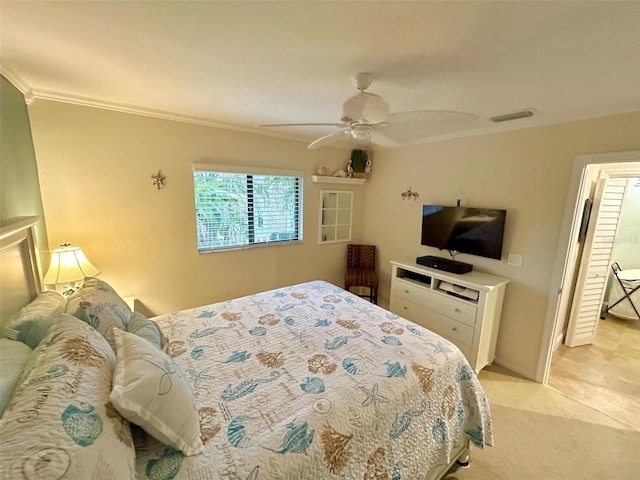 carpeted bedroom featuring ceiling fan and ornamental molding