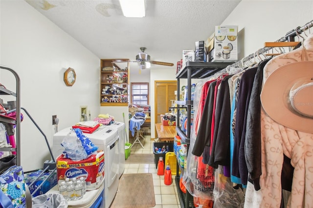 interior space featuring washer and dryer, light tile patterned floors, a textured ceiling, and ceiling fan