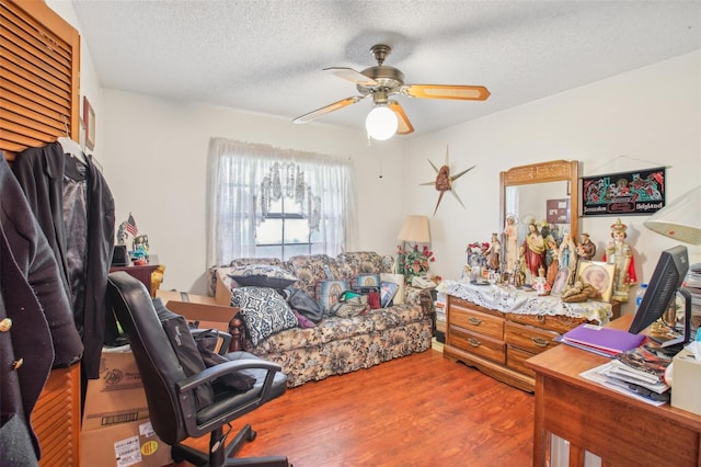 office area with hardwood / wood-style floors, a textured ceiling, and ceiling fan