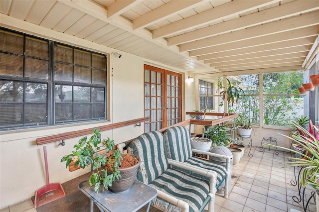 sunroom with beamed ceiling