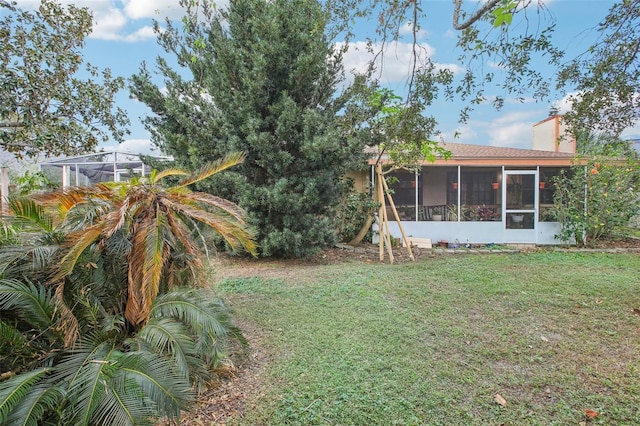 view of yard featuring a sunroom