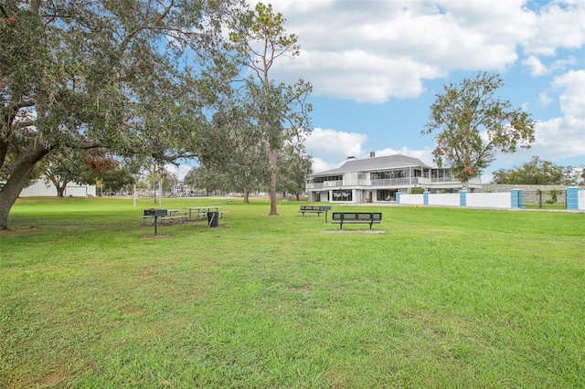 view of home's community with a yard