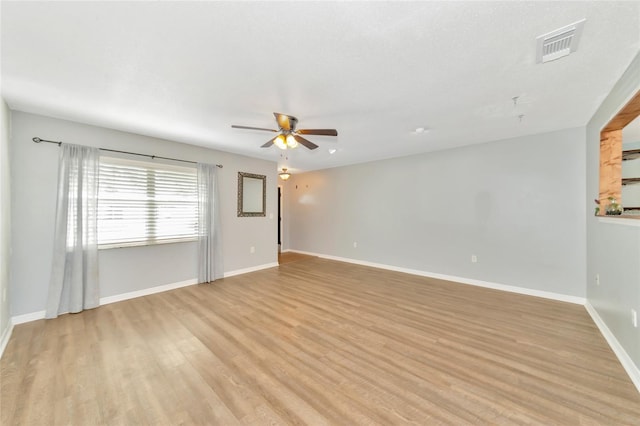 spare room featuring light hardwood / wood-style floors and ceiling fan