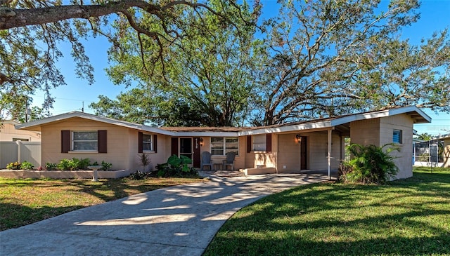 single story home with a front yard