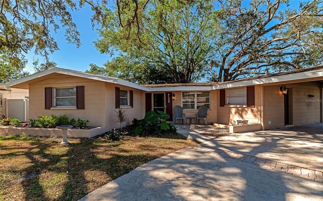 ranch-style home featuring a front yard