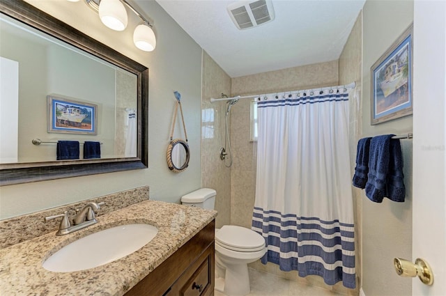 bathroom featuring a shower with curtain, vanity, toilet, and tile patterned flooring