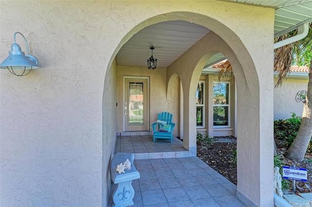 doorway to property with stucco siding