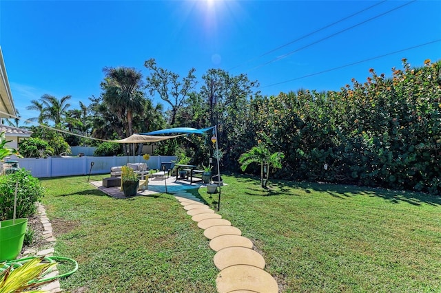 view of yard featuring an outdoor hangout area, a patio, and fence