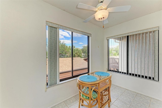 tiled dining room with ceiling fan