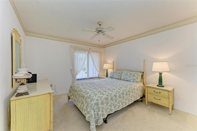 carpeted bedroom featuring ceiling fan, a textured ceiling, and ornamental molding