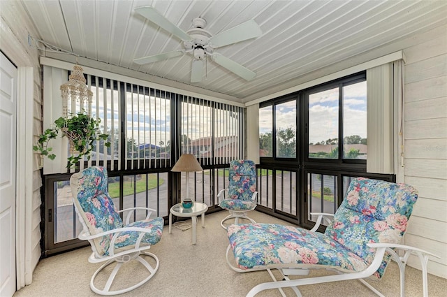 sunroom featuring ceiling fan