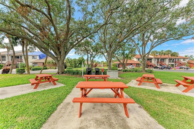 view of property's community featuring a yard