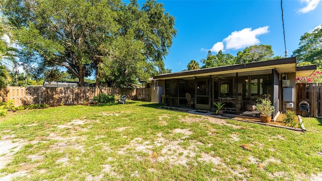 view of yard featuring a sunroom