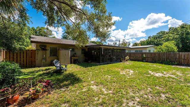 view of yard featuring a sunroom