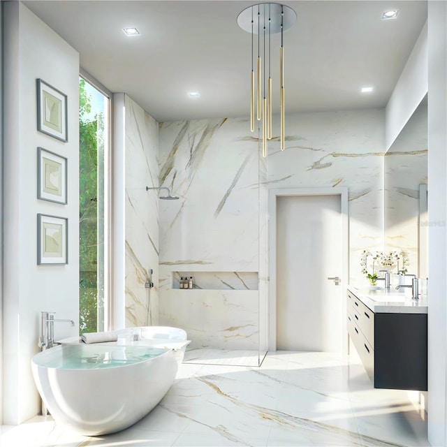 bathroom with expansive windows, vanity, and a washtub