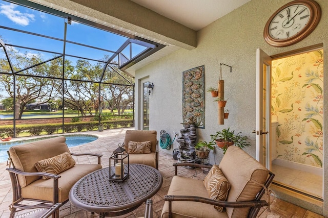 view of patio / terrace with a lanai