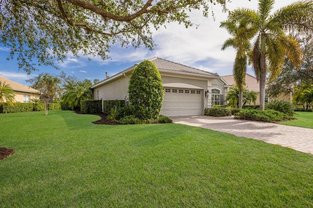 single story home featuring a front yard and a garage