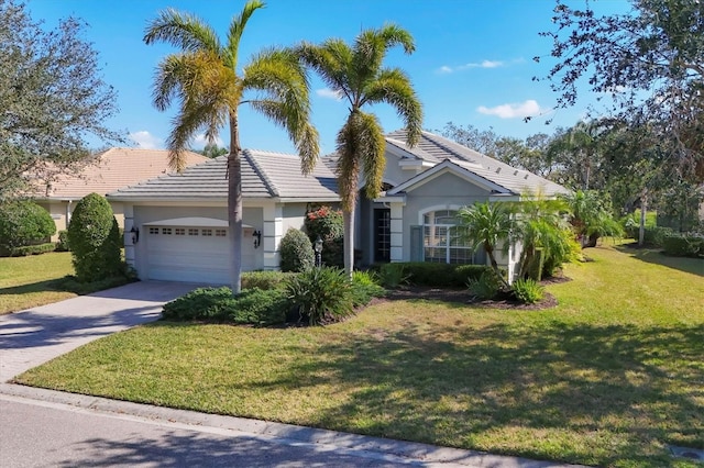 single story home featuring a garage and a front lawn