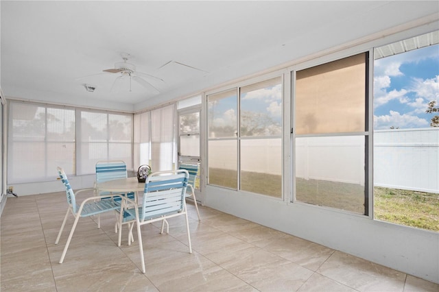 sunroom / solarium with ceiling fan