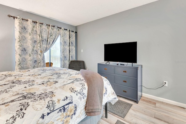 bedroom with light wood-type flooring