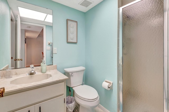 bathroom featuring toilet, an enclosed shower, and vanity