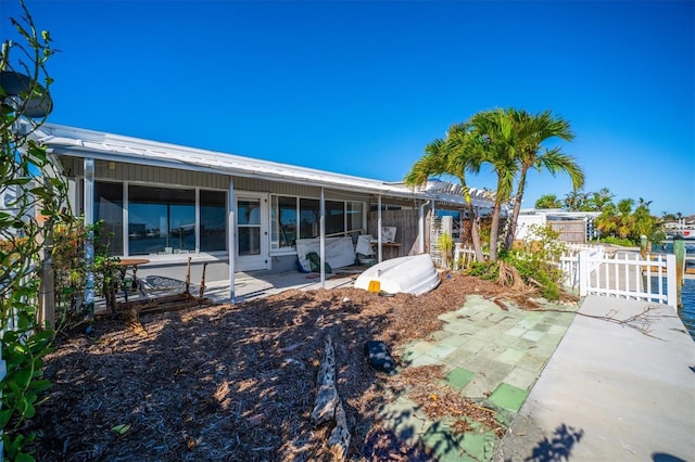 back of house with a patio