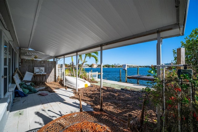 view of patio / terrace featuring a boat dock and a water view