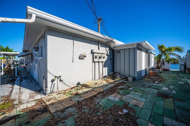 view of property exterior featuring a patio area