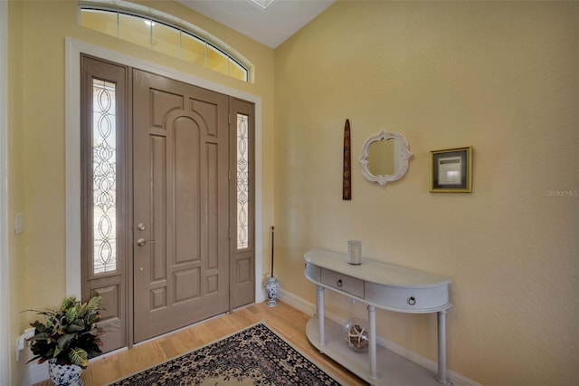 foyer with light hardwood / wood-style flooring and plenty of natural light