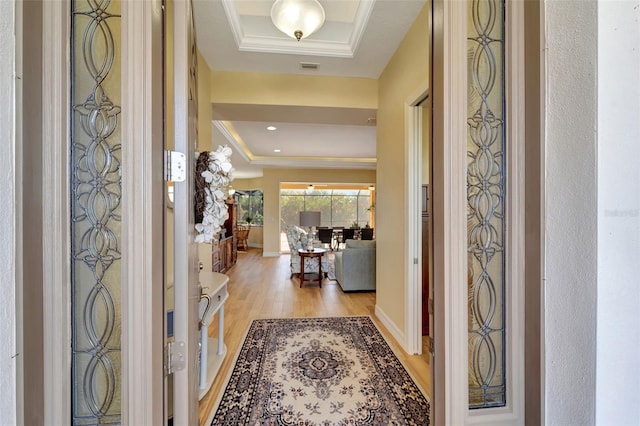 entrance foyer with light wood-type flooring and ornamental molding