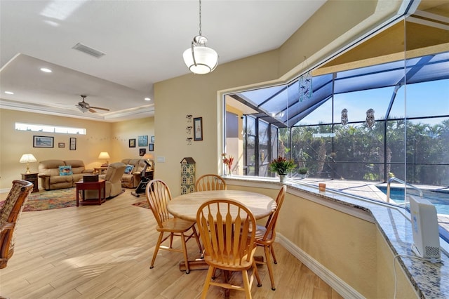 dining space featuring ceiling fan and light hardwood / wood-style floors