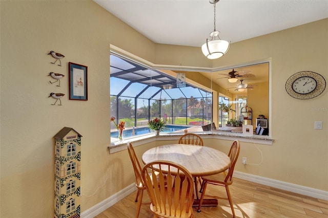 dining room featuring ceiling fan and light hardwood / wood-style floors