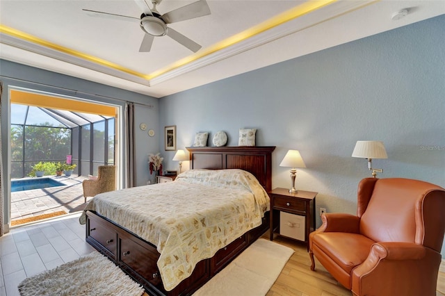 bedroom featuring access to outside, a raised ceiling, ceiling fan, and light hardwood / wood-style floors