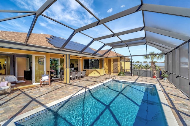 view of pool with a lanai and a patio