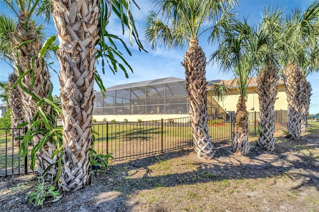 view of yard with glass enclosure