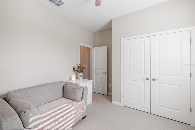 living area featuring light colored carpet