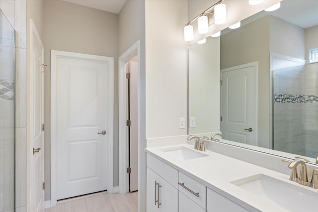 bathroom with vanity and an enclosed shower