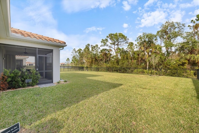 view of yard featuring a sunroom