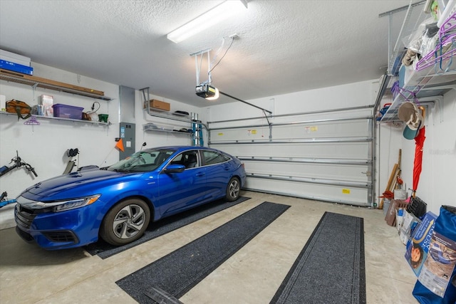 garage with electric panel and a garage door opener