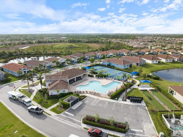 birds eye view of property with a water view