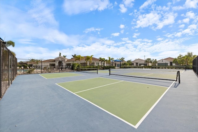 view of sport court featuring basketball hoop