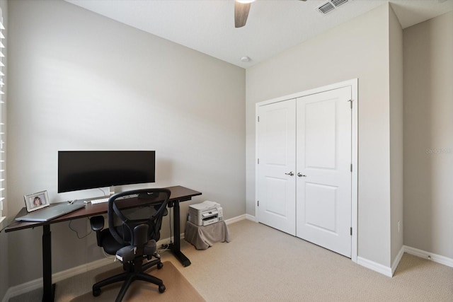 office featuring ceiling fan and light colored carpet