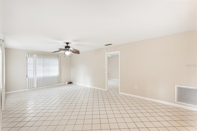 spare room featuring light tile patterned floors and ceiling fan