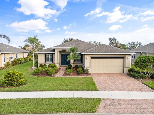 ranch-style house featuring a front lawn and a garage