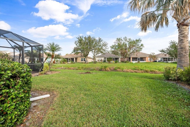 view of yard with a lanai