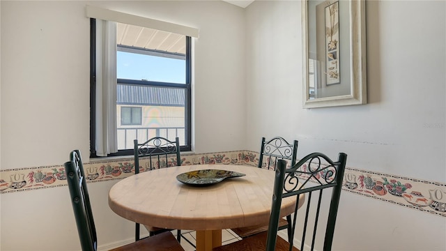 dining area featuring hardwood / wood-style floors