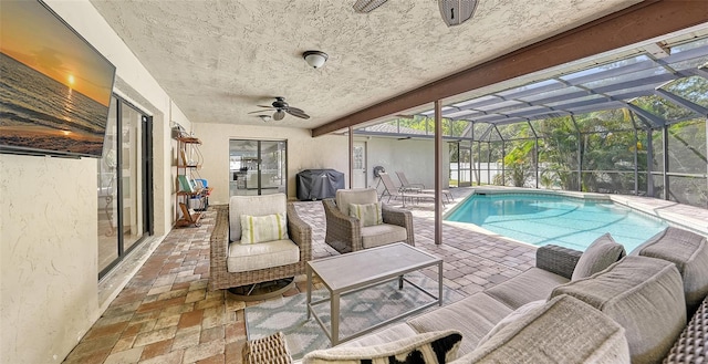 view of swimming pool with a lanai, outdoor lounge area, area for grilling, and a patio