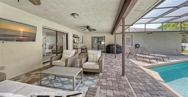 exterior space featuring outdoor lounge area, area for grilling, ceiling fan, and a lanai